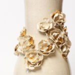 Eden Rose under Golden Dawn floral ceramic vase with sculpted roses and gold accents