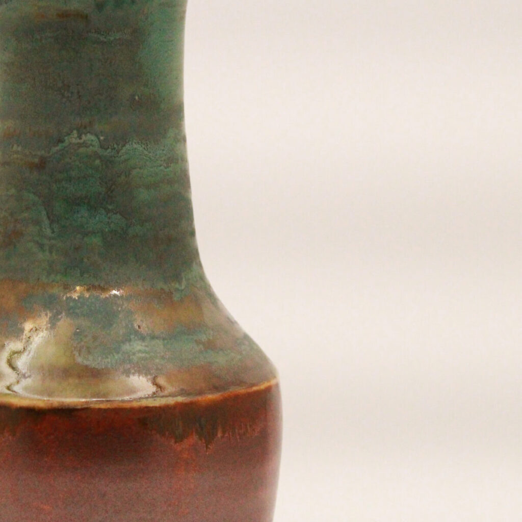 Hierarchy ceramic vase with copper base and layered green glaze, front view