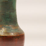 Hierarchy ceramic vase with copper base and layered green glaze, front view