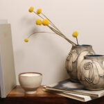 Lunette handmade face vase in ceramic on clean background