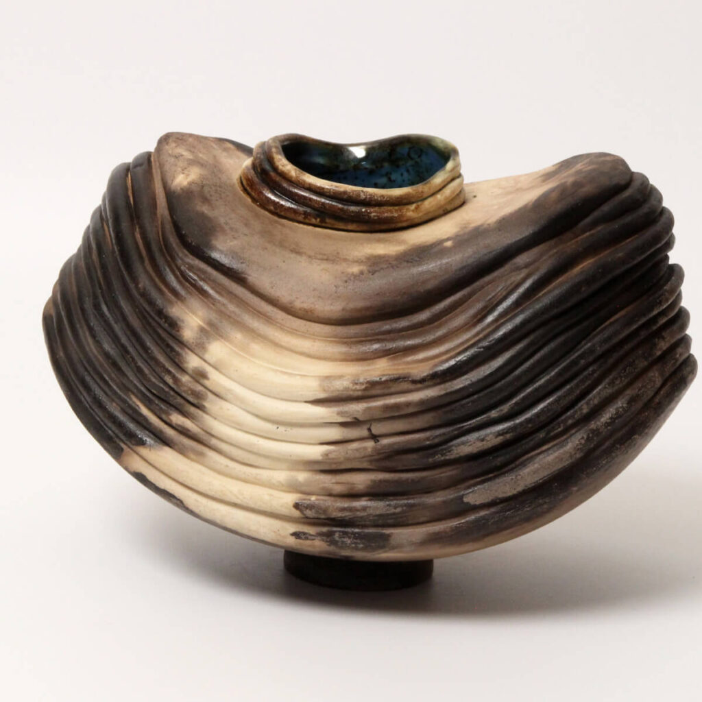 Nature’s Little Shrug sculptural ceramic vessel on white background