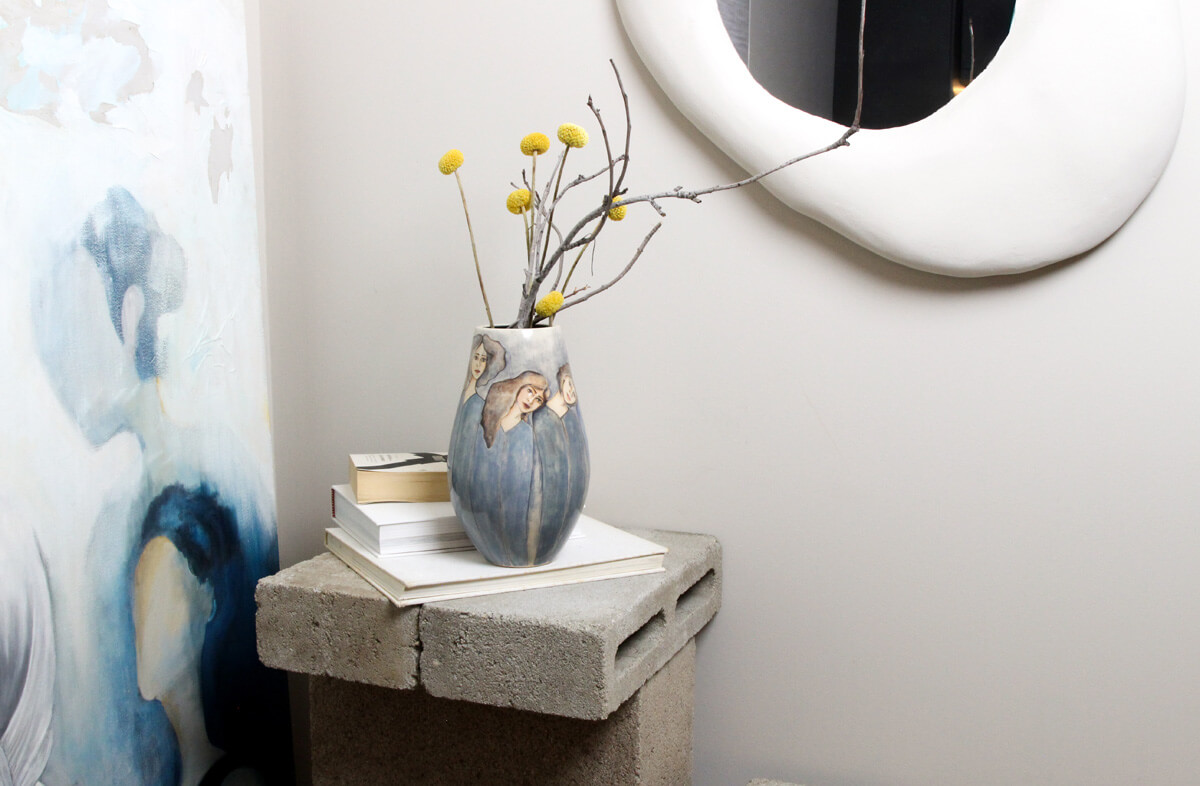 Repeat After Me ceramic vase styled on console table in a modern interior