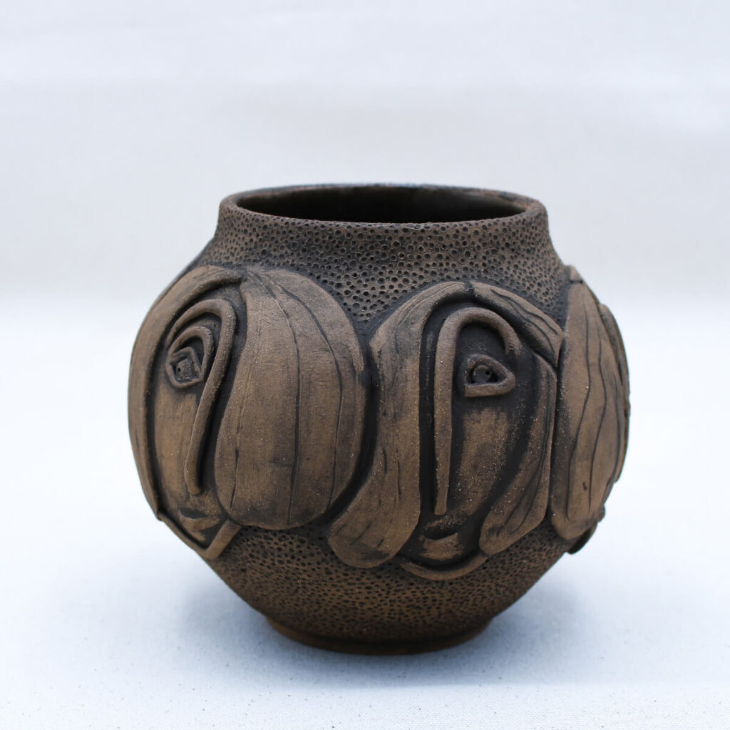 Sohalia handmade ceramic face vase on white background