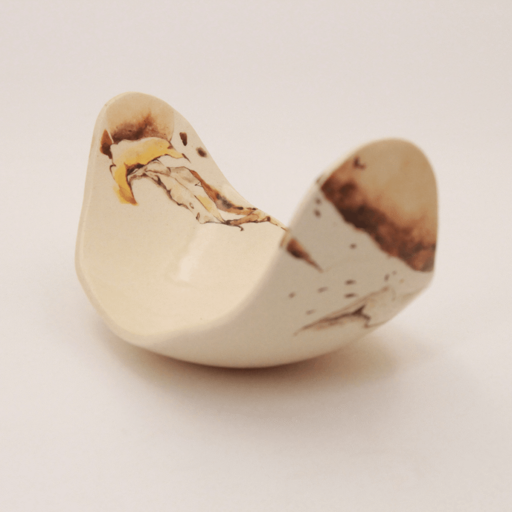 Painted handmade ceramic bowl with warm painterly glaze detail