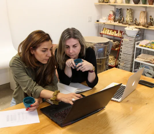 Lilia and Alisa collaborating on creative ideas in the Untitled Square art studio.
